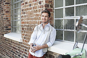 Similar – Man sitting in a bench on a beautiful maroon background