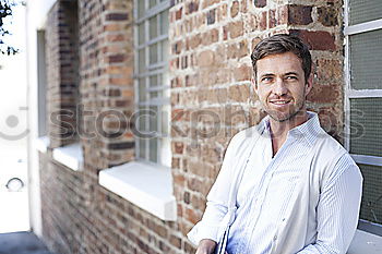 Man sitting in a bench on a beautiful maroon background