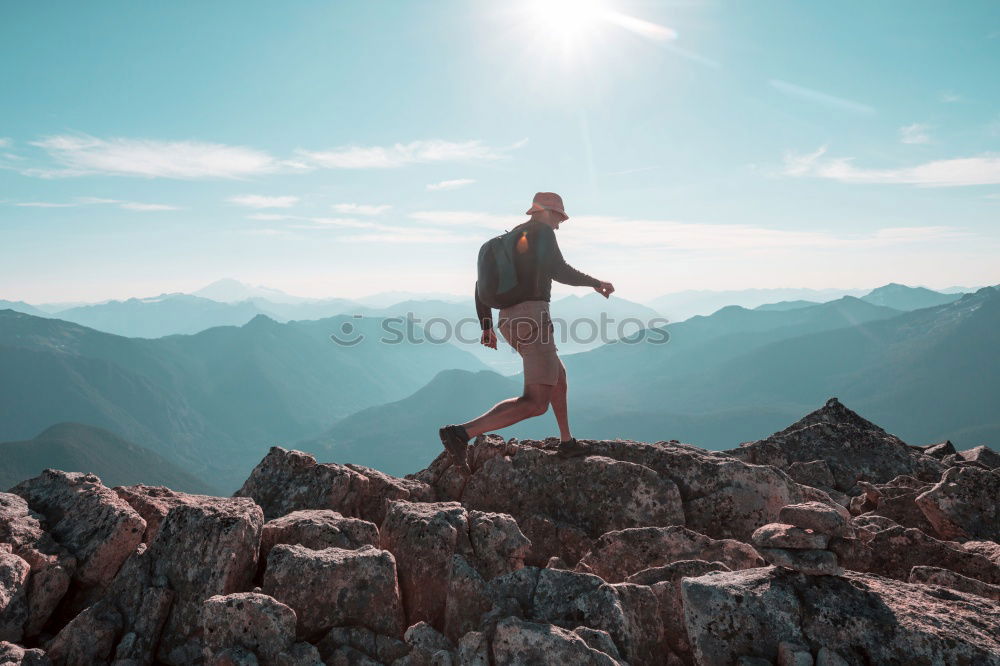 Similar – Tourist jumping over gorge