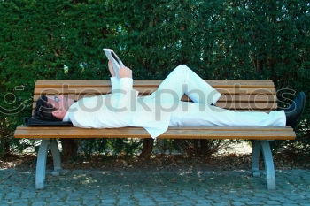 Similar – Image, Stock Photo I am angry, older man with hat and glasses sits on a colourful bench in the evening,,