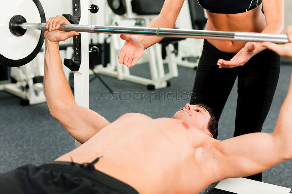 Similar – Image, Stock Photo Female personal trainer helping a young man lift weights