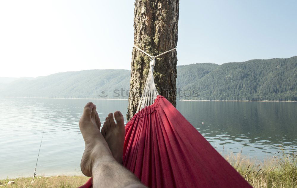 Similar – Image, Stock Photo Man in hammock on mountain lake