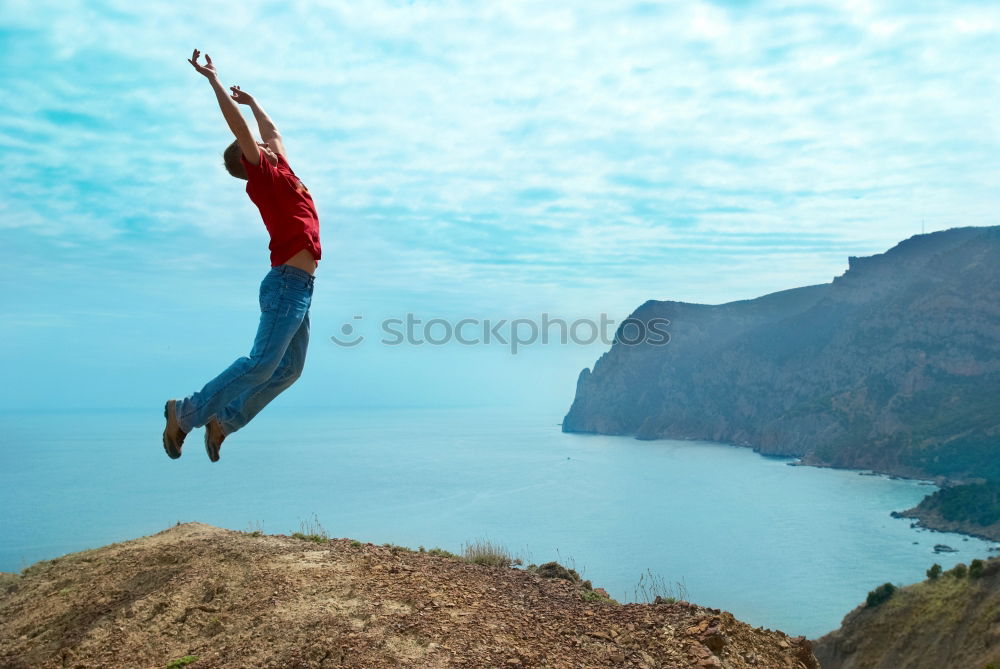 Similar – Image, Stock Photo Man jumping of a cliff