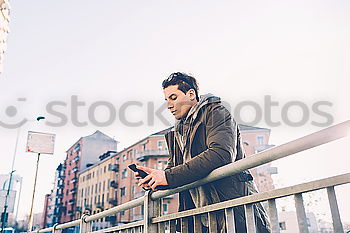 Similar – Young modern man sitting on halfpipe taking picture with Camera