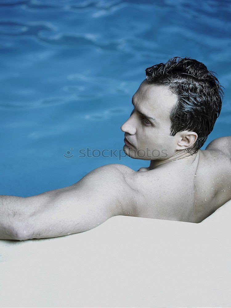 Similar – Young handsome man posing near a pool