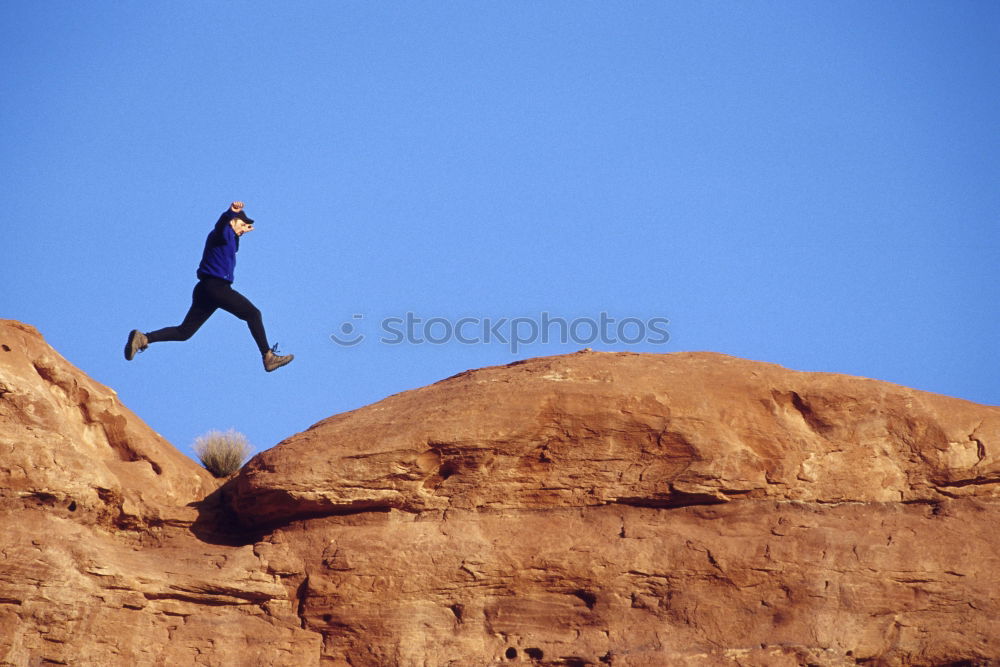 Similar – Climber and his camp dangling from a cliff.