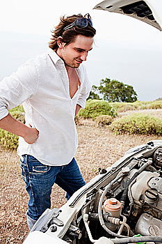 Similar – young guy repairing an old car