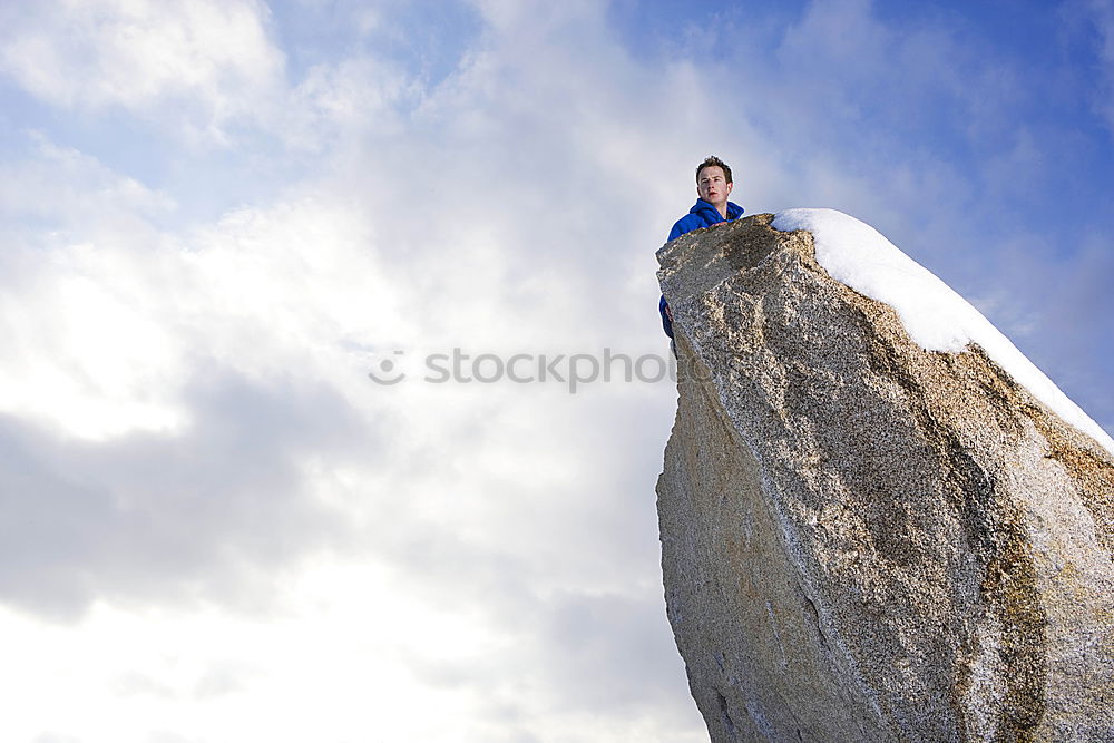 Similar – Climber reaching for a helping-hand.