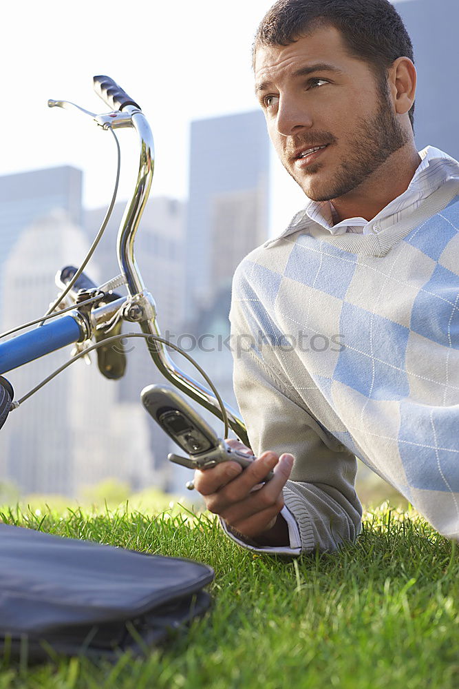 Similar – Image, Stock Photo Young man with mobile phone and fixed gear bicycle