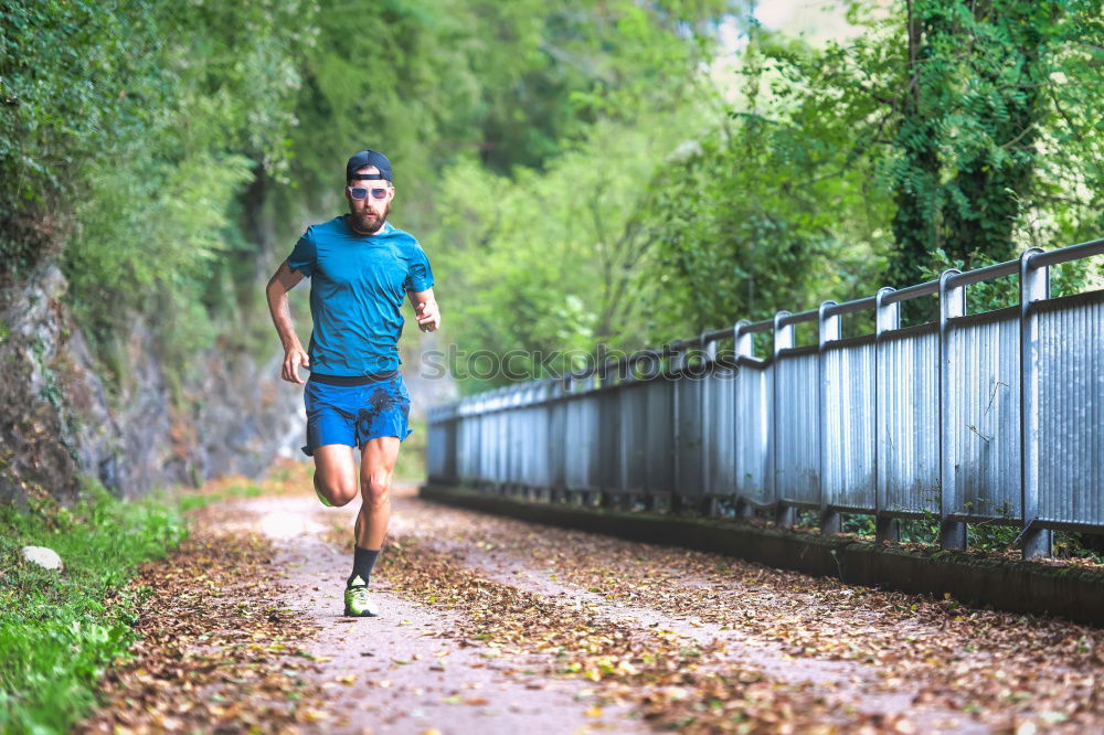 Similar – Young sports man is running up the stairs for his workout