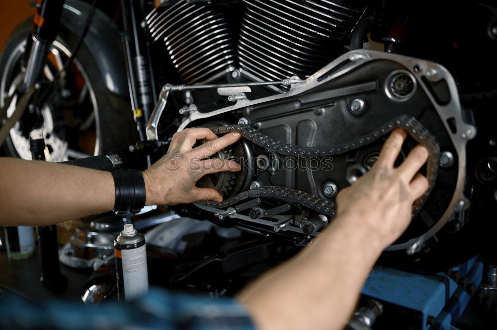 Similar – Man working on bike in shop