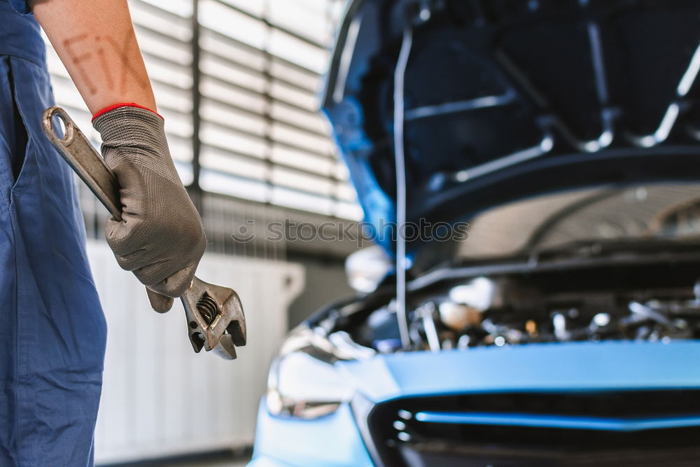 Similar – Image, Stock Photo Professional Mechanic Repairing Car Engine.