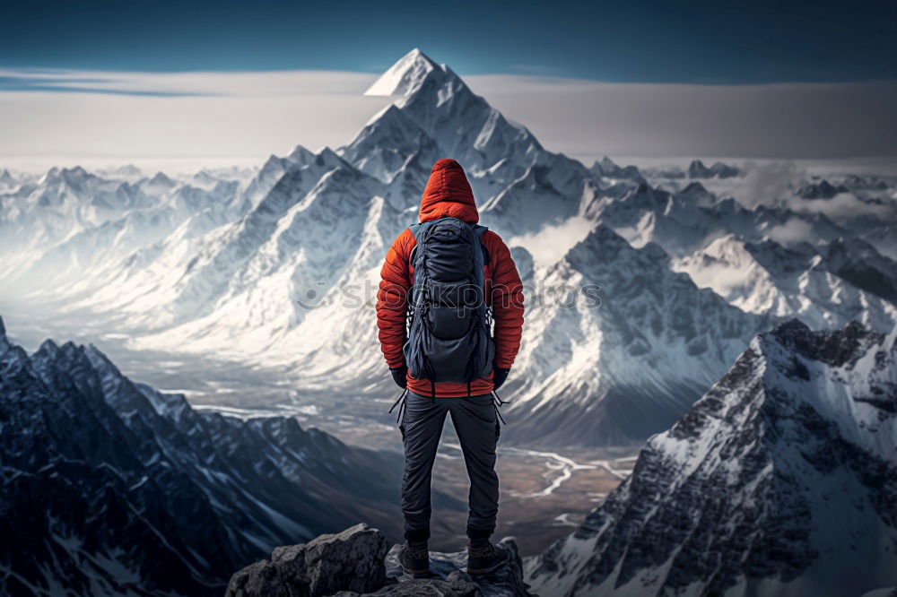 Similar – Tourist standing on stone in mountains