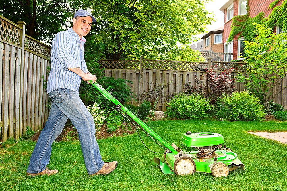 Similar – Image, Stock Photo Spraying pesticides with a portable sprayer to eliminate weeds from the lawn. Weed killer spray on the weeds in the garden. Pesticide use is harmful to health. Weed control concept. Weed killer