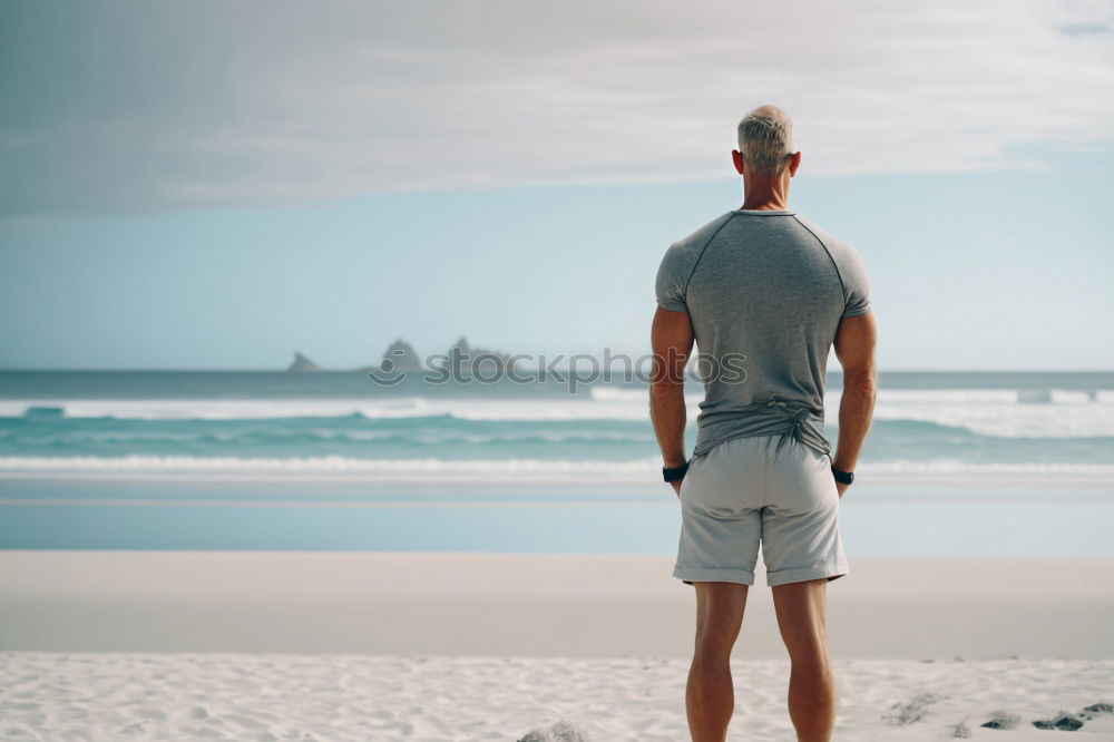 Image, Stock Photo tough muscular man is doing stretching at railing to beach