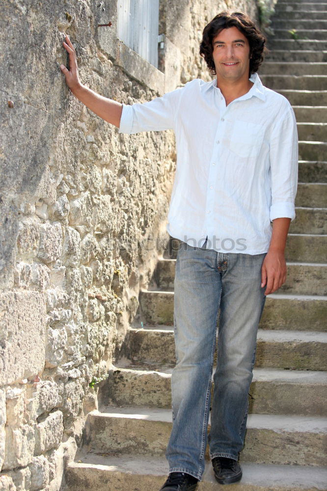 Similar – Portrait of a mature man sitting on steps in the street