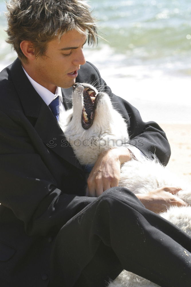 Similar – Image, Stock Photo Cute puppy licking face of young male adult