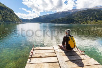 Similar – Image, Stock Photo Tourist looking at riverside town