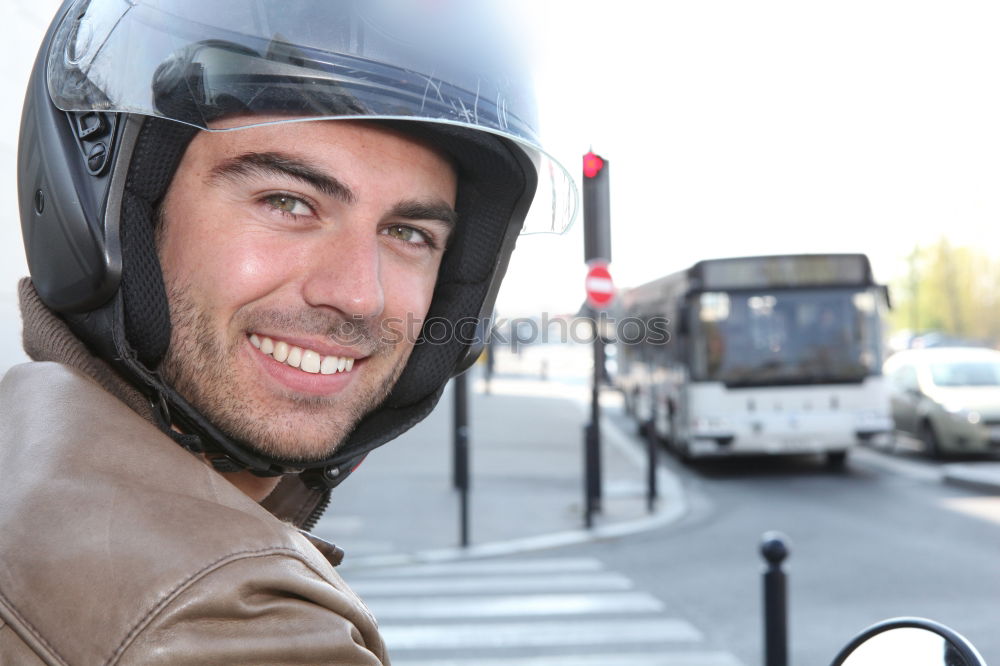 Similar – Man on bike at garage