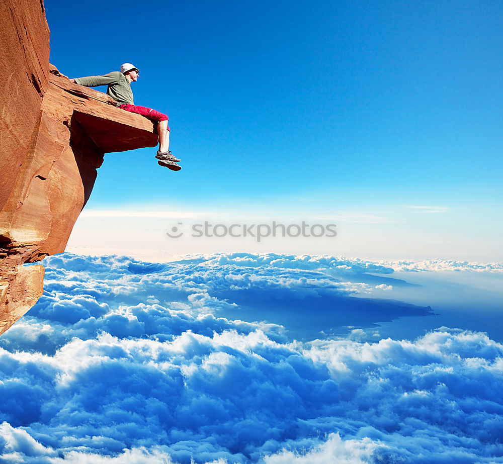 Similar – Rock climber falling upside down.