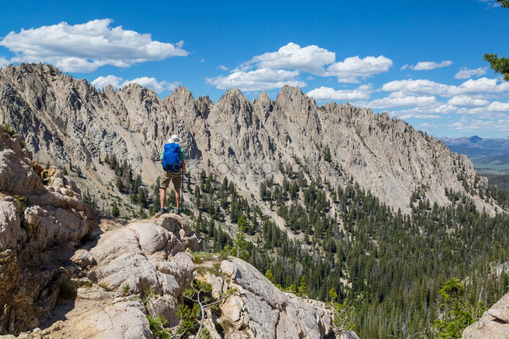 Similar – Image, Stock Photo Climbing sport: young boy takes a rest observing panorama