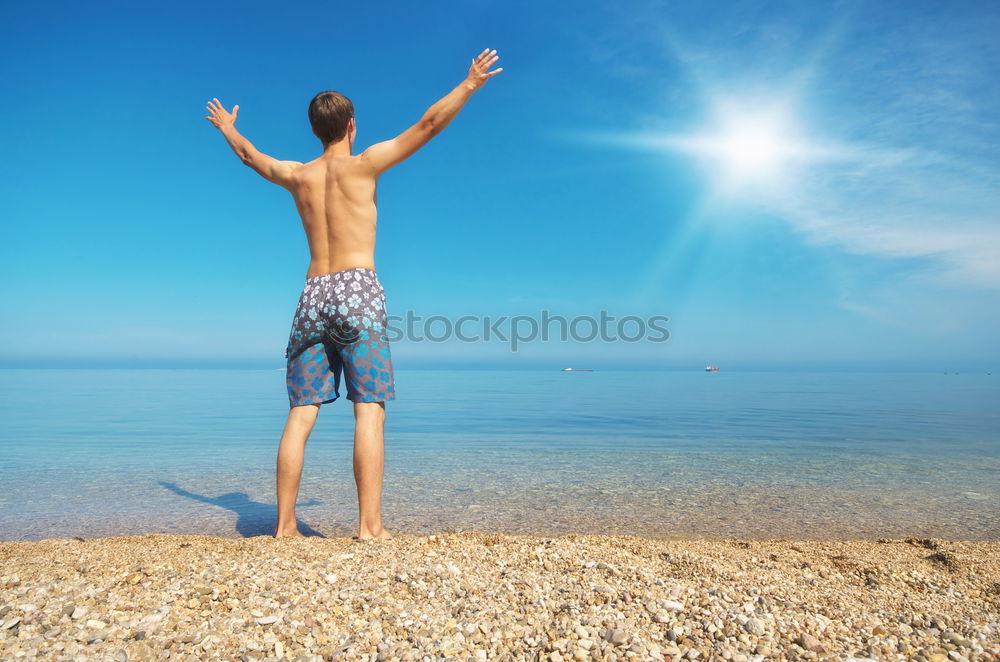 Similar – The happiest childhood: father and son walking along the tropical beach