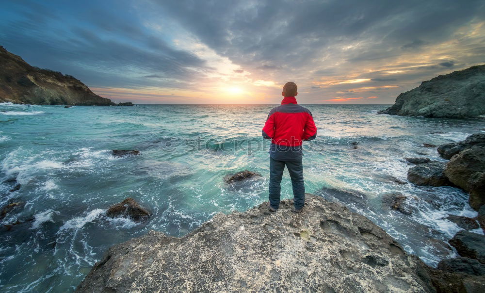 Similar – Tourist standing at wavy ocean