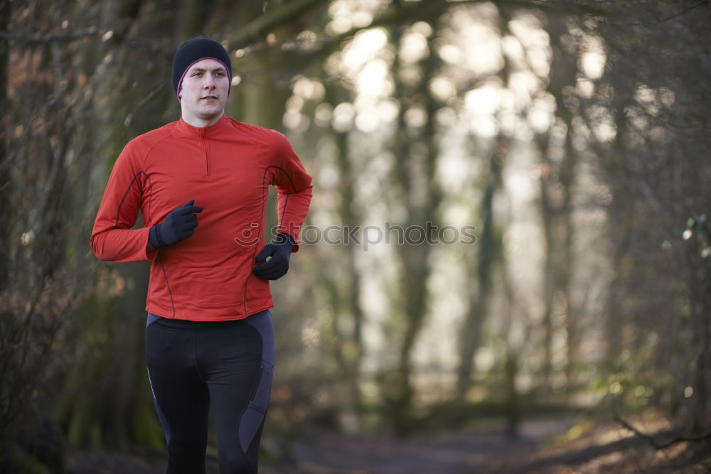 Similar – Male trail athlete posing with race number