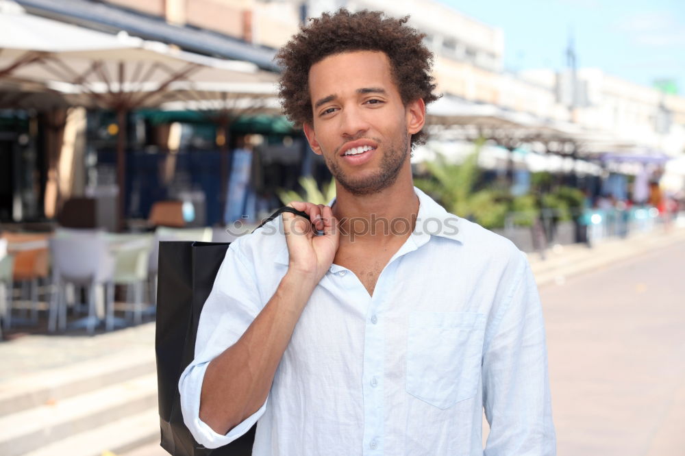 Similar – Image, Stock Photo Black young man with a smartphone in his hand