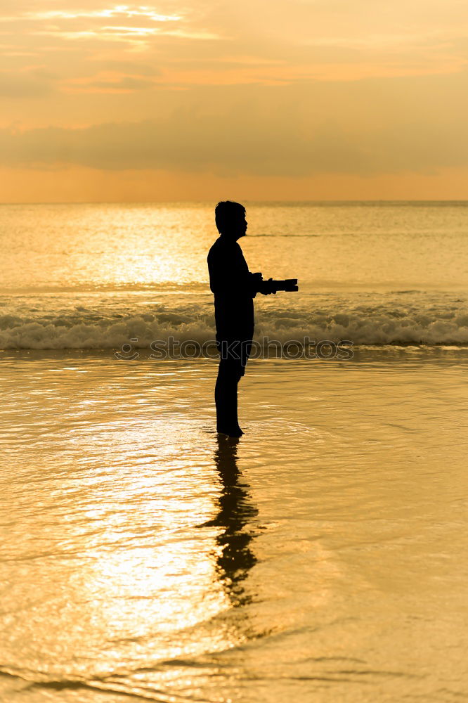 Similar – Image, Stock Photo Father and son playing on the beach at the sunset time. People having fun outdoors. Concept of happy vacation and friendly family.