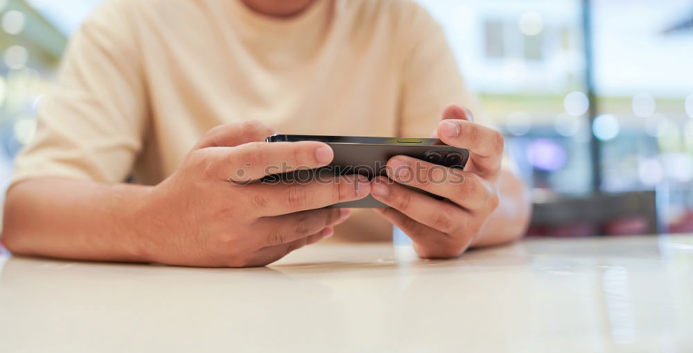 Similar – Close up of hands using smartphone