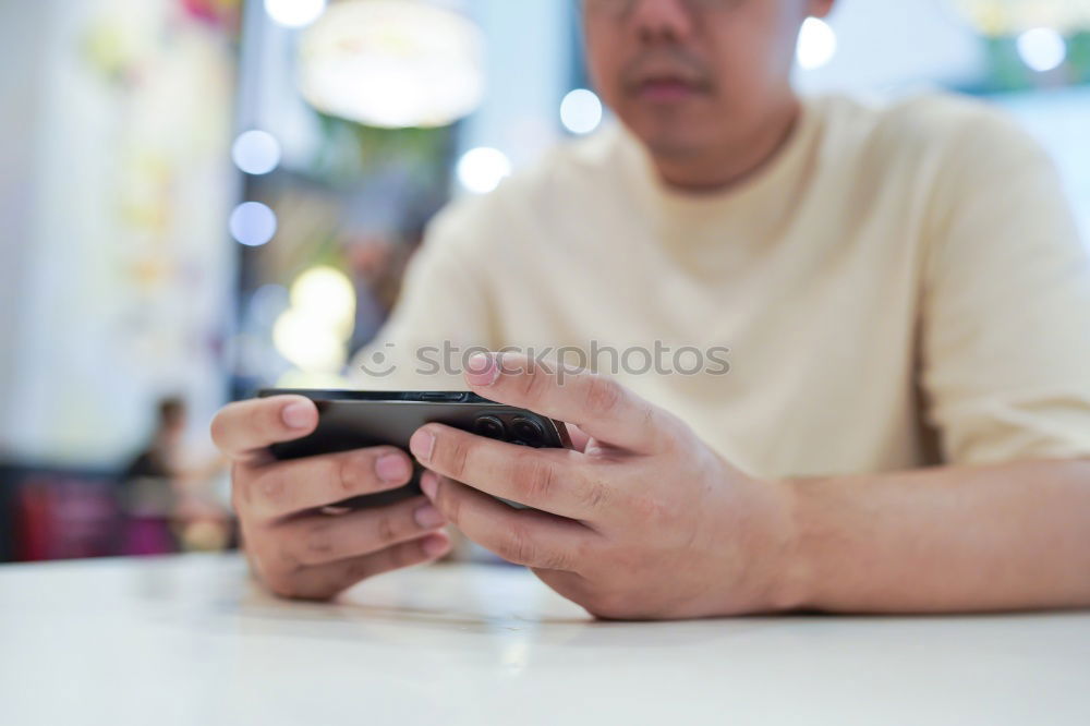 Similar – Close up of hands using smartphone