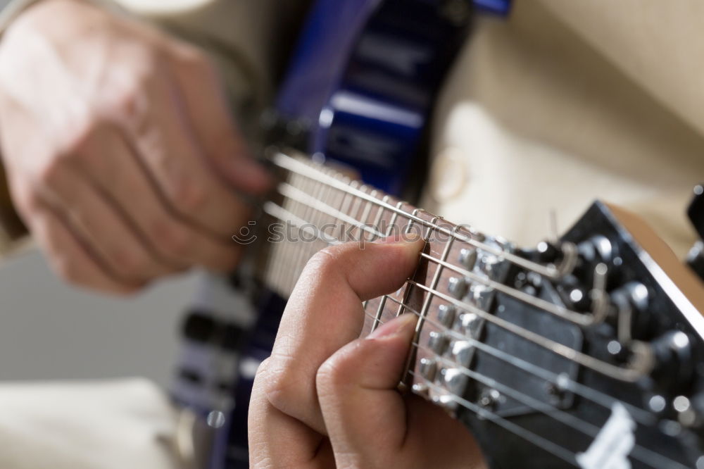 Similar – Man playing electric guitar