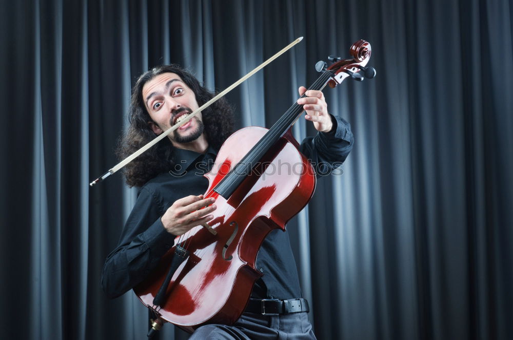 Similar – Image, Stock Photo Guitarist sitting on guitar combo