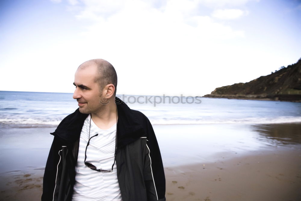 Adult man standing on beach