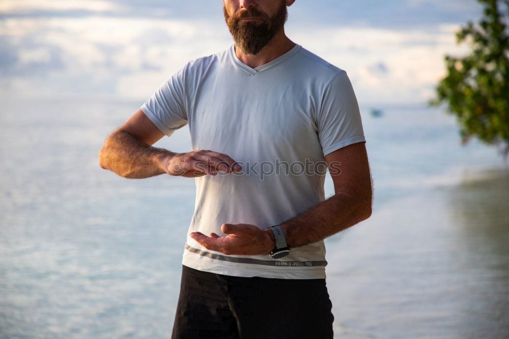 Similar – Image, Stock Photo tough muscular man is doing stretching at railing to beach