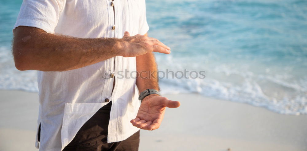 Similar – Man standing with skateboard at shore