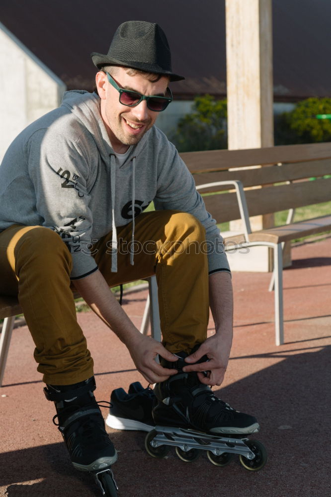 Similar – Portrait of young skateboarder man with bad boy face in the middle of the street.