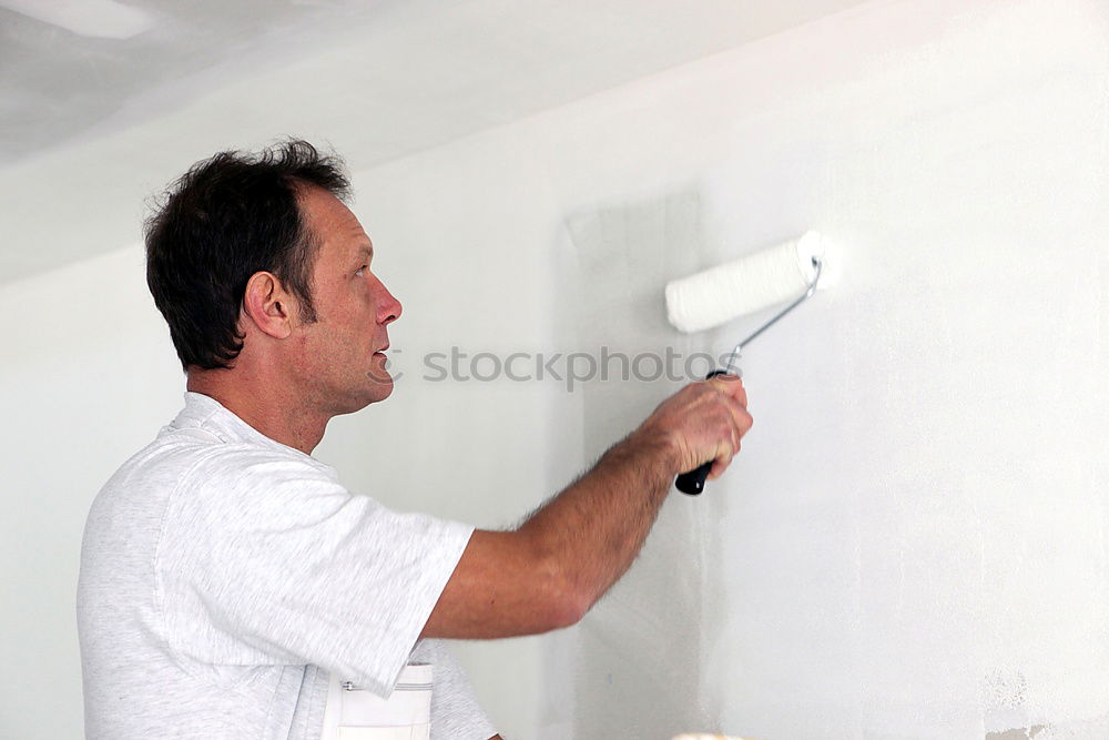 Similar – Image, Stock Photo Man painting a wardrobe