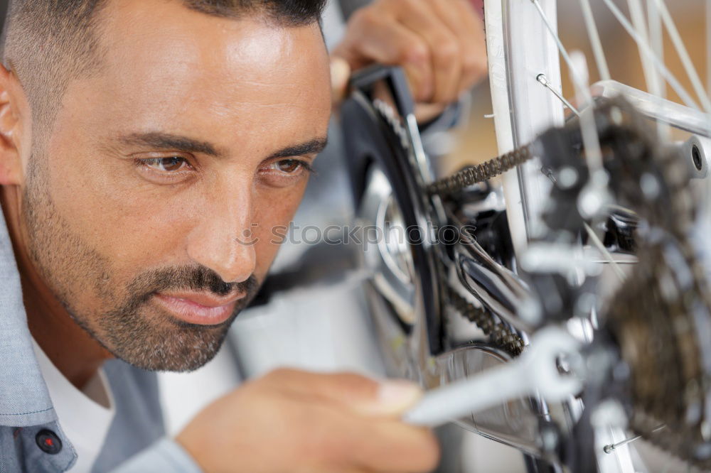 Similar – Professional Mechanic Repairing Car.