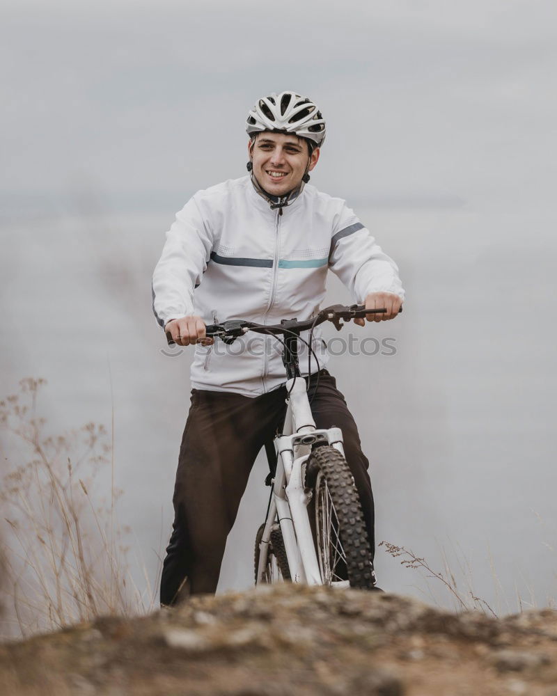 Similar – Image, Stock Photo Sporty young woman in helmet with bicycle looking at camera