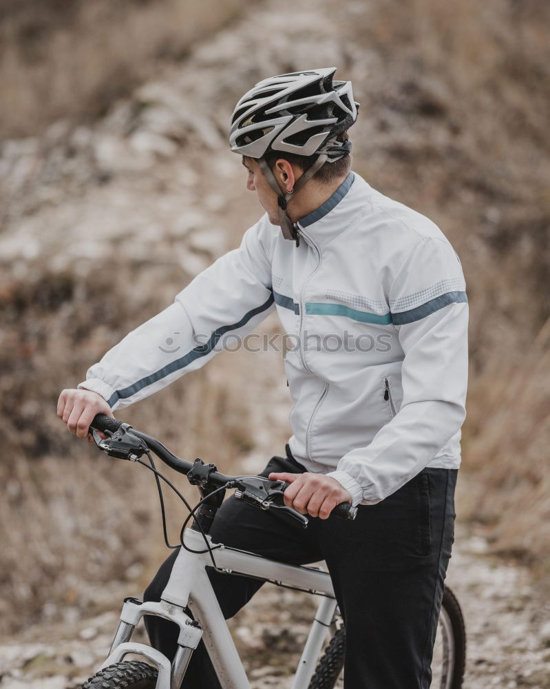 Similar – Cyclist Riding a bike at sunset. Sports