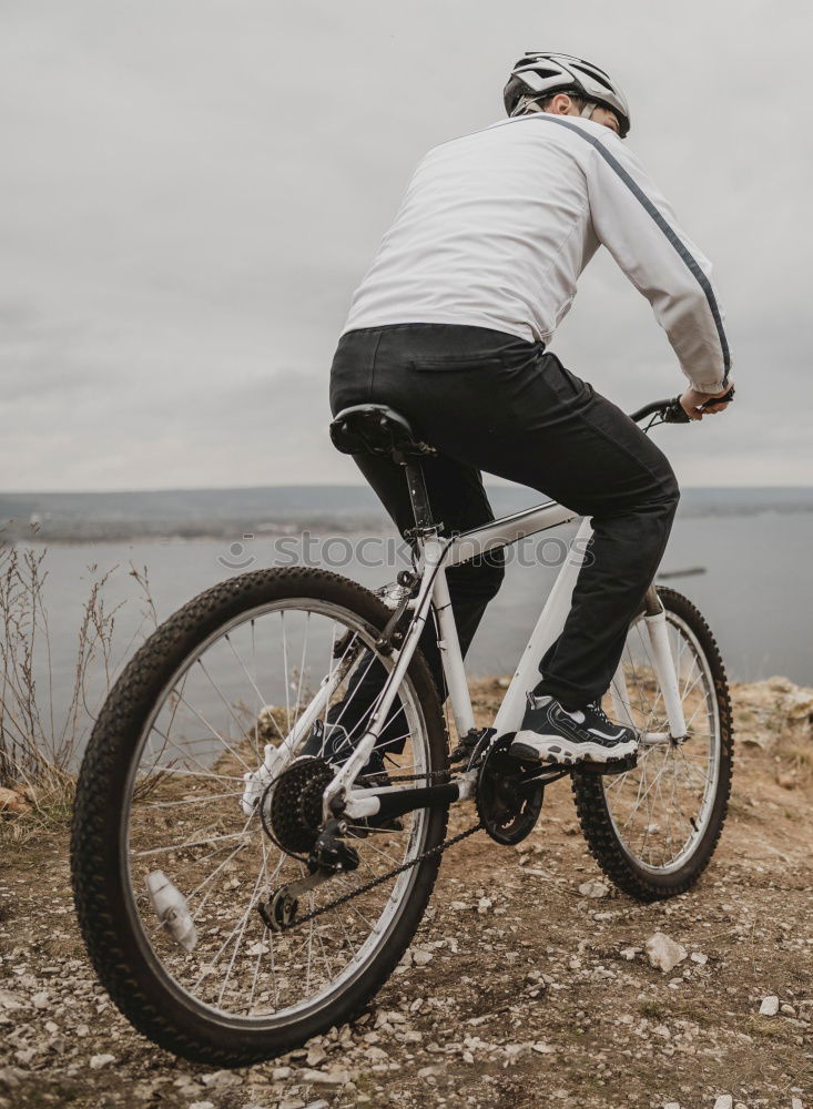 Similar – Cyclist Riding a bike at sunset. Sports