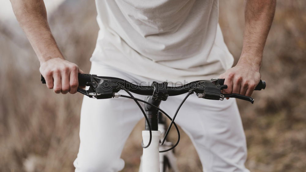 Similar – Sportlicher Mann mit Fahrrad beim Telefonieren