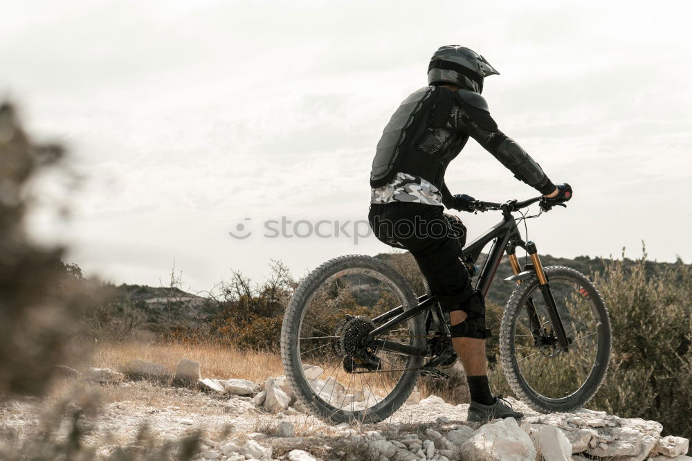 Similar – Mann beim Wandern mit Mountainbike