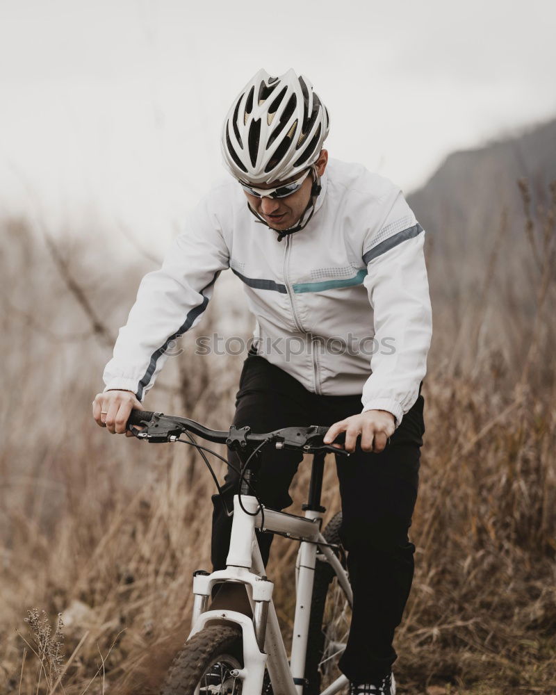 Similar – Cyclist Riding a bike at sunset. Sports