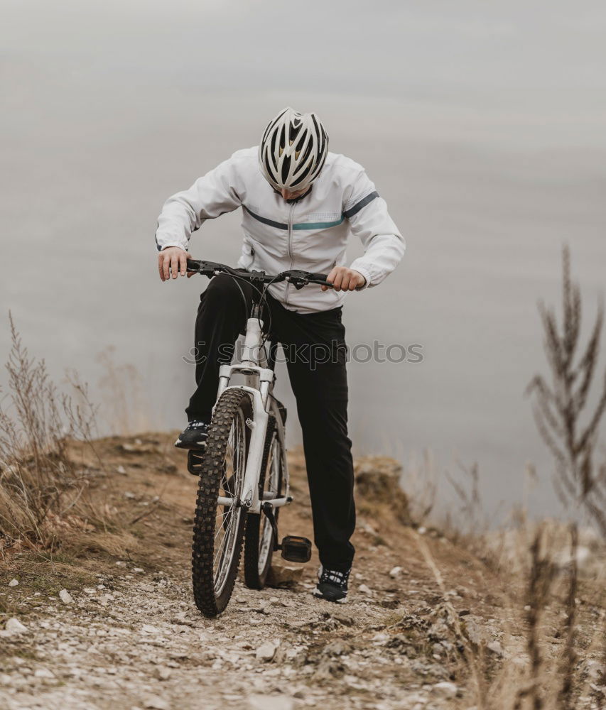 Similar – Cyclist Riding a bike at sunset. Sports