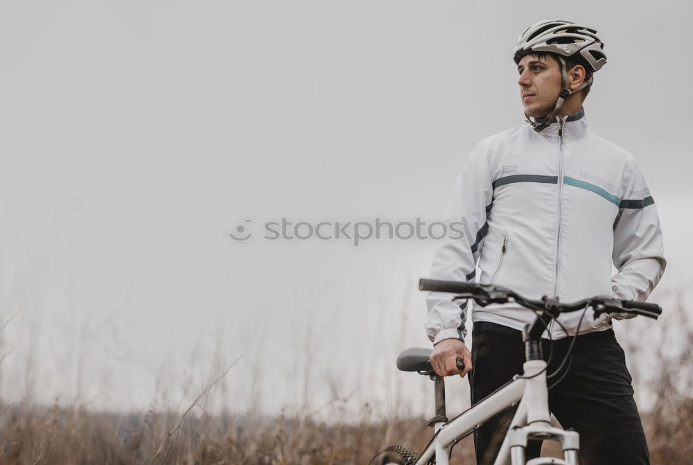 Similar – Image, Stock Photo Sporty young woman in helmet with bicycle looking at camera