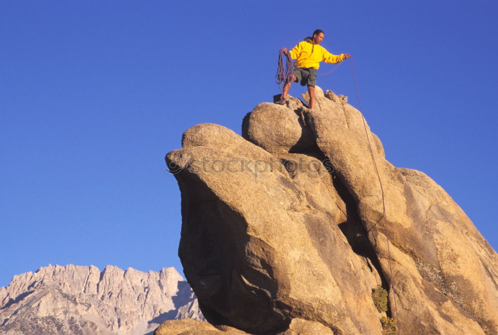 Similar – Climber and his camp dangling from a cliff.