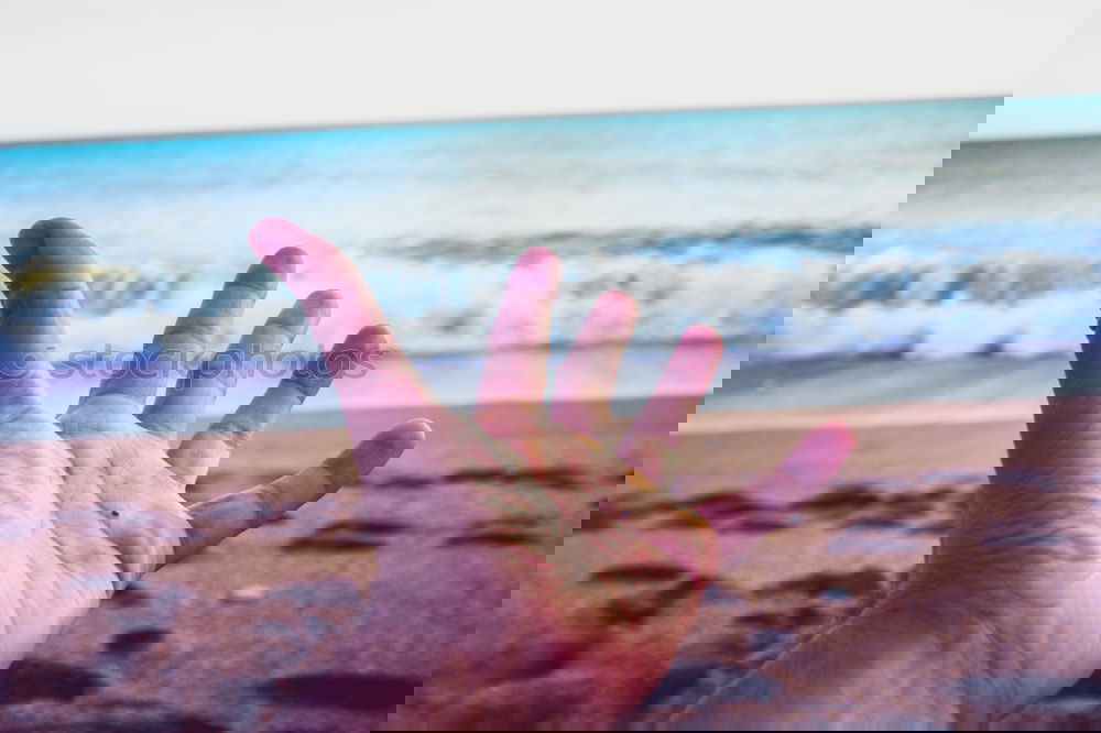 Similar – Image, Stock Photo Crop male hand on background of ocean
